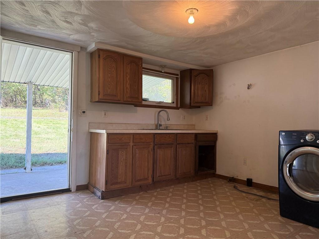 71 Beech Street Muse, PA 15350 - Photo 13 of 21 a kitchen with a sink cabinets and a window