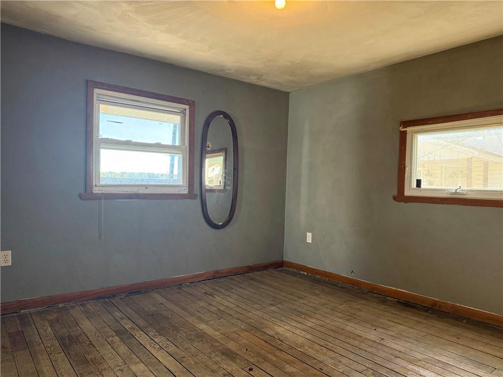 71 Beech Street Muse, PA 15350 - Photo 18 of 21 an empty room with wooden floor and windows