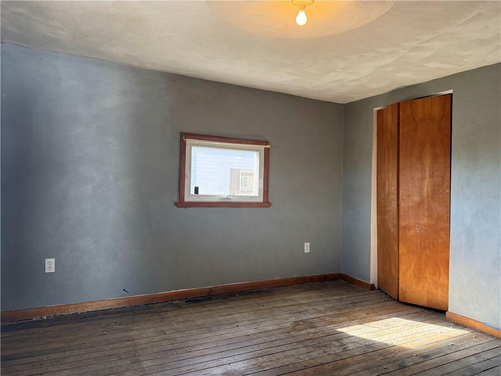 71 Beech Street Muse, PA 15350 - Photo 19 of 21 a view of an empty room with wooden floor and a window