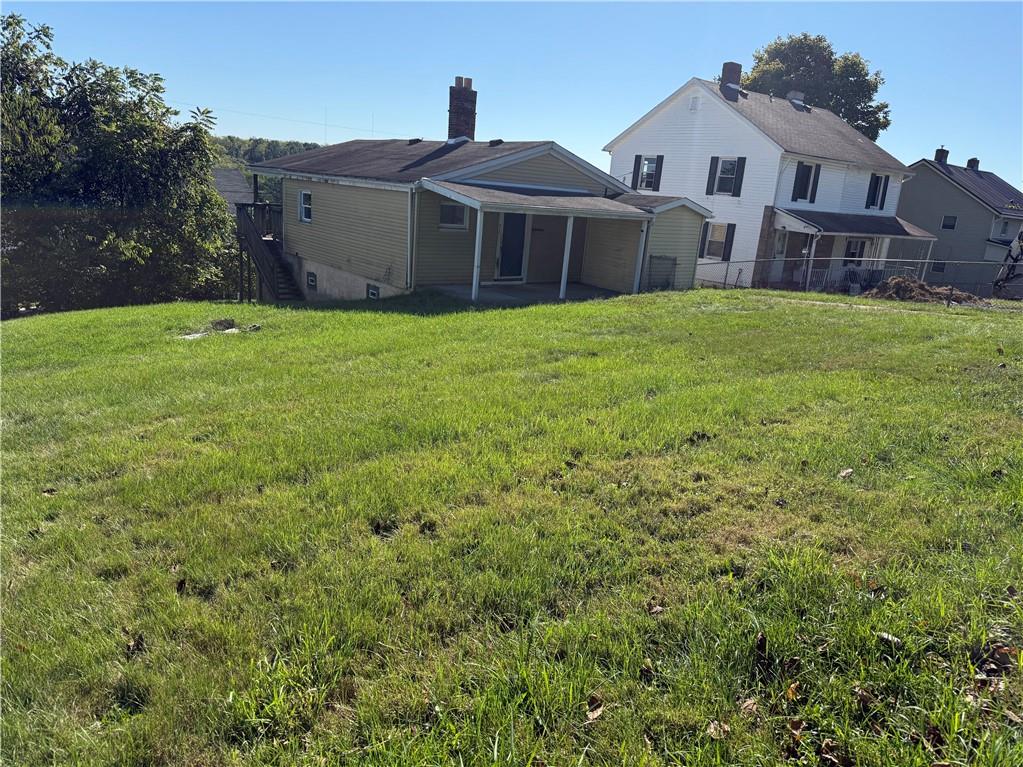 71 Beech Street Muse, PA 15350 - Photo 7 of 21 a view of a house with a yard and a porch