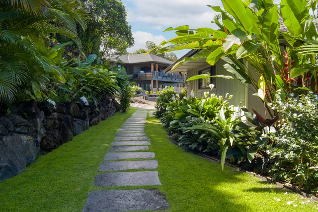 a front view of a house with garden