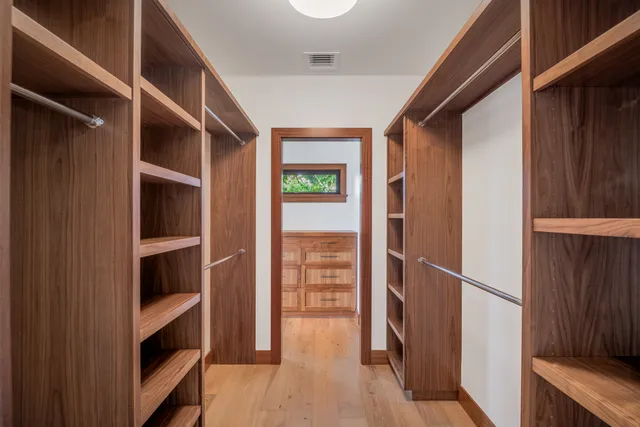 a bathroom with a granite countertop tub a sink and mirror