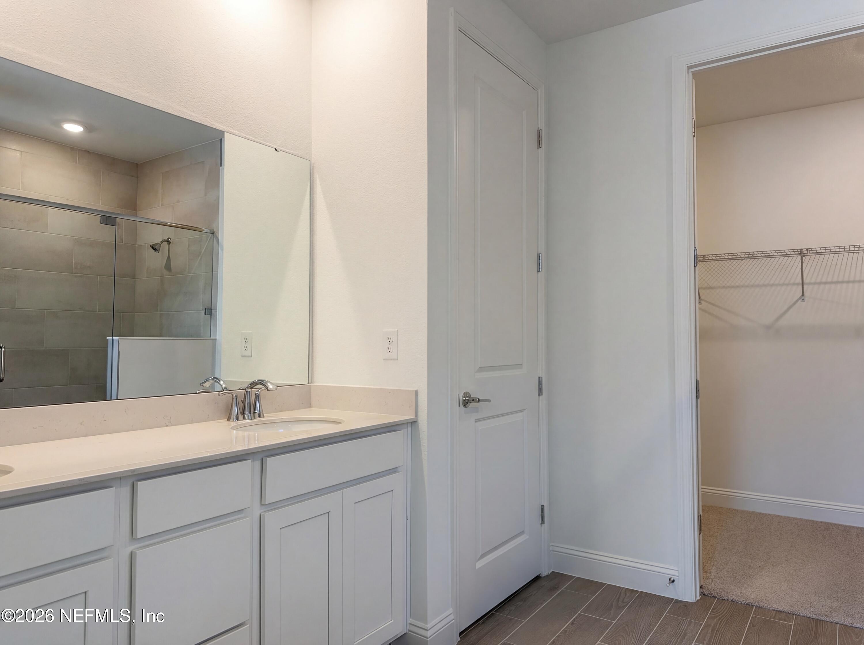 88 Round Robin St. Johns, FL 32259 - Photo 12 of 25 a bathroom with a sink and a mirror