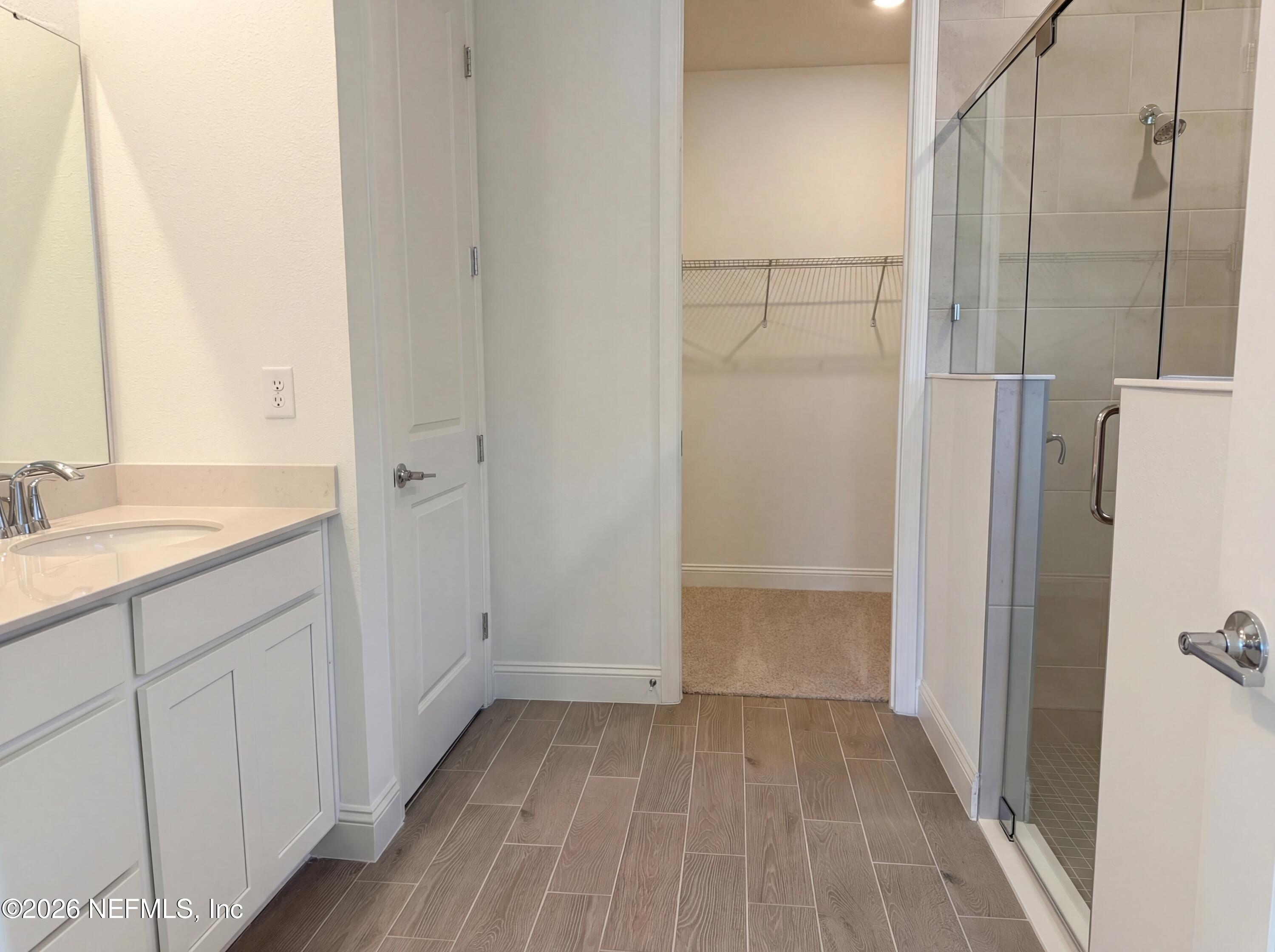 88 Round Robin St. Johns, FL 32259 - Photo 13 of 25 a bathroom with a sink and a mirror