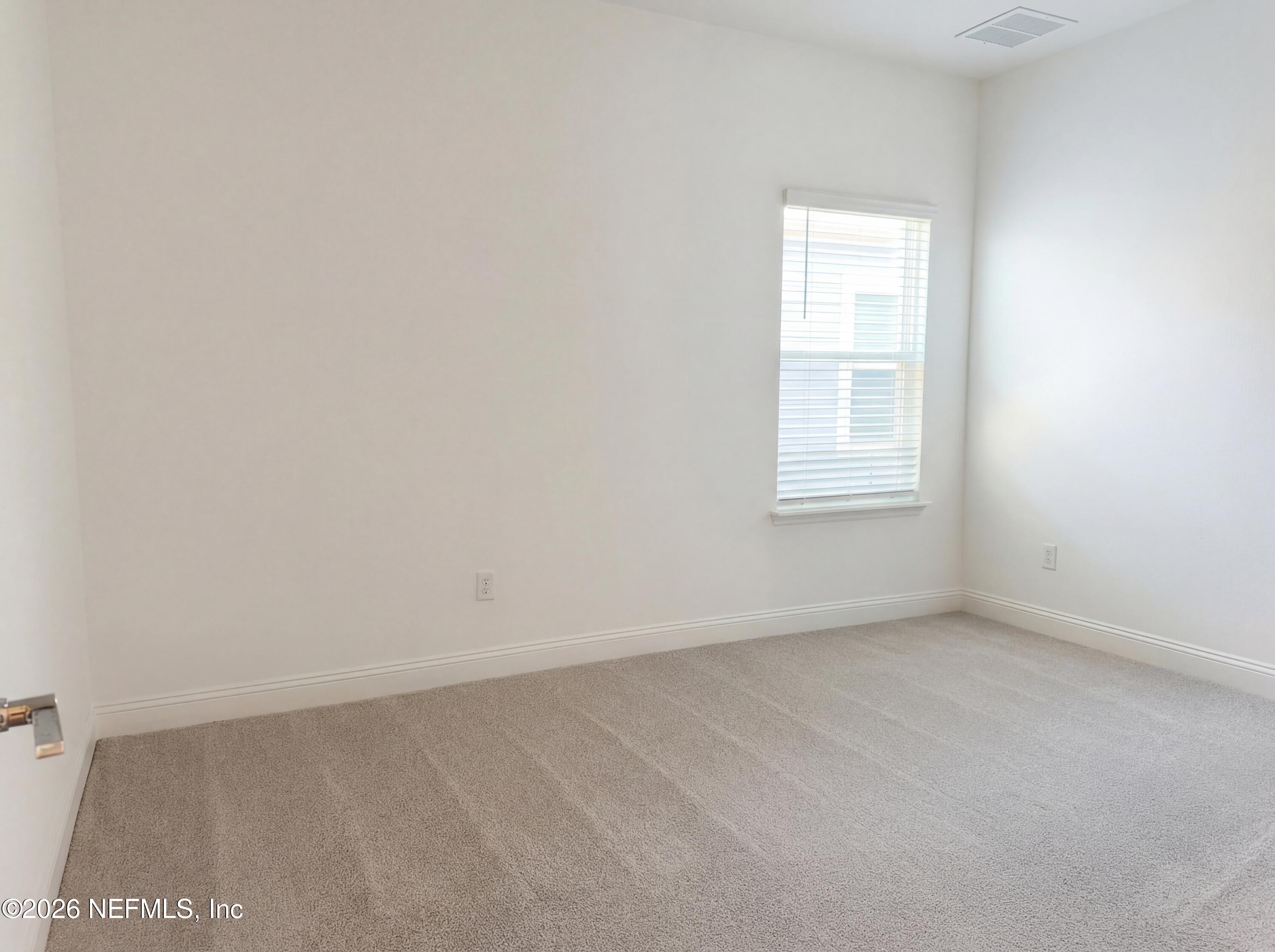 88 Round Robin St. Johns, FL 32259 - Photo 20 of 25 an empty room with a window