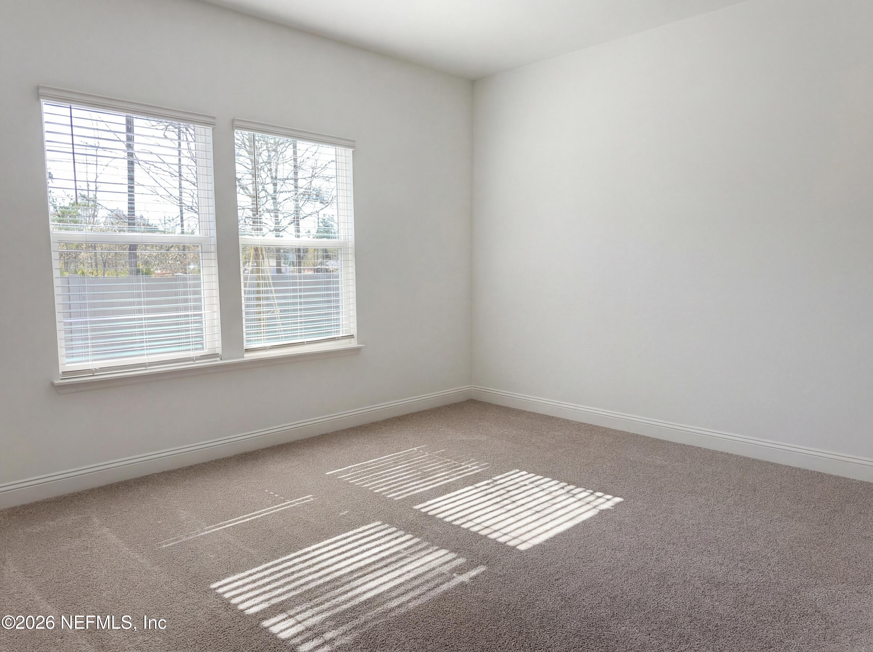 88 Round Robin St. Johns, FL 32259 - Photo 4 of 25 an empty room with a window