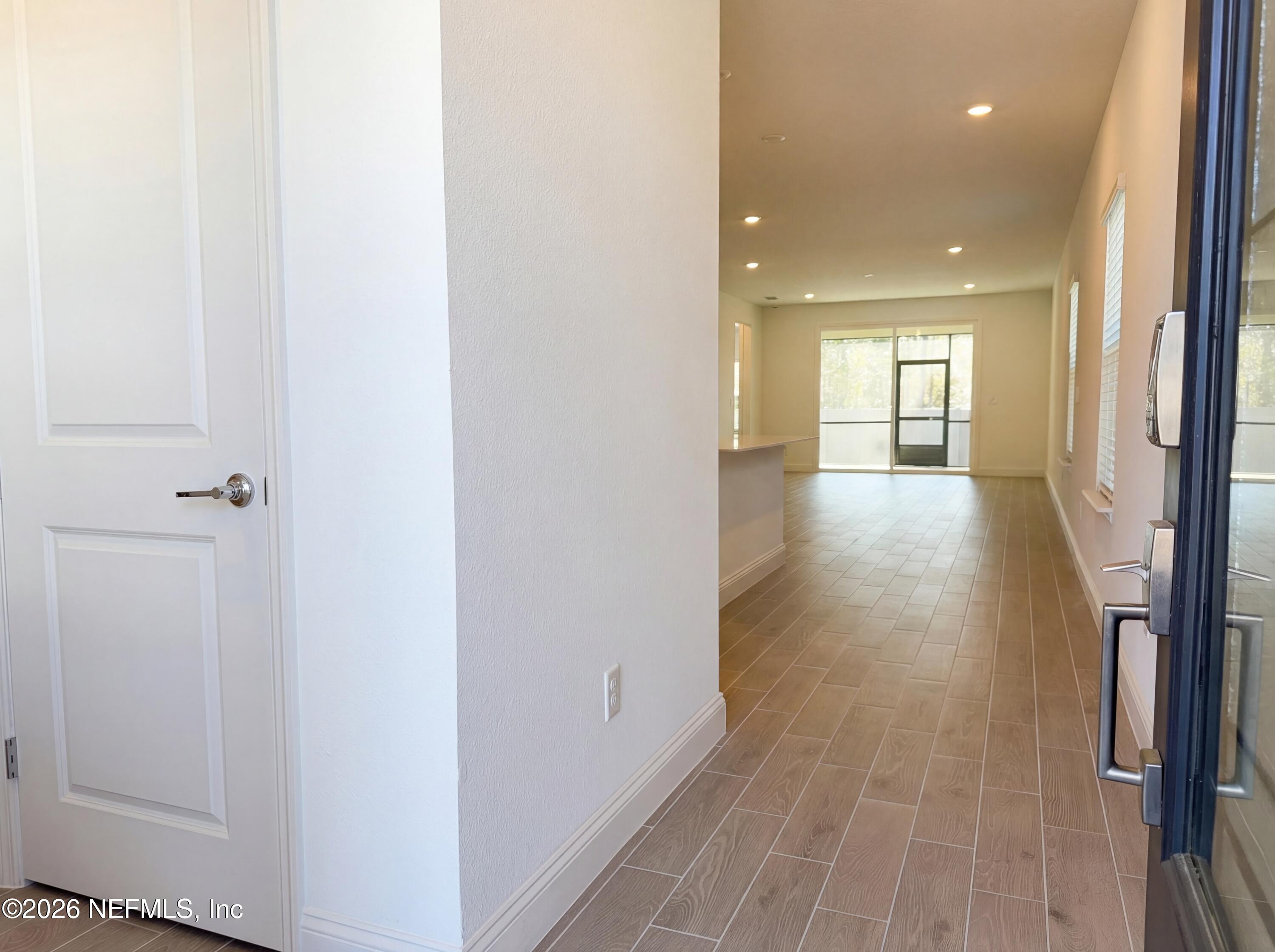 88 Round Robin St. Johns, FL 32259 - Photo 6 of 25 a view of a hallway with wooden floor