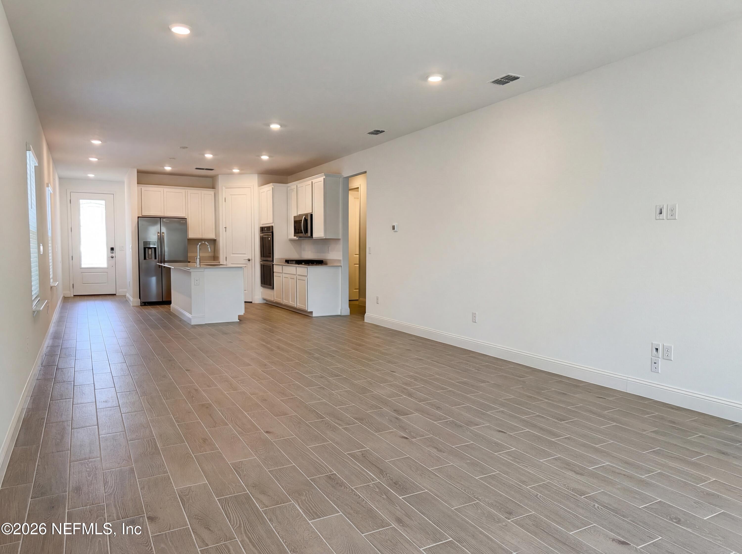 88 Round Robin St. Johns, FL 32259 - Photo 9 of 25 a view of kitchen with furniture and wooden floor