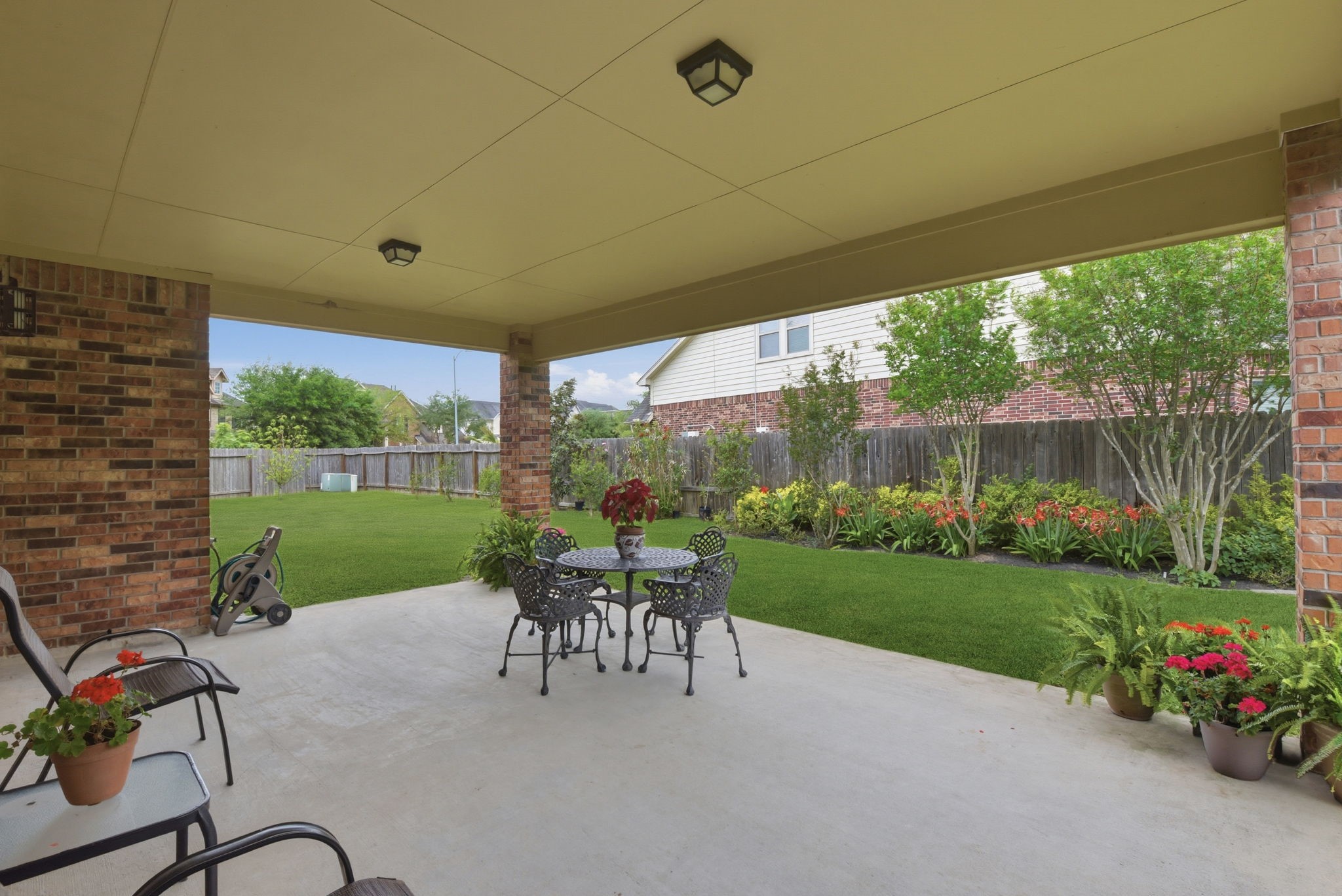3301 Remington Rise Lane Katy, TX 77494 - Photo 41 of 50 a view of a patio with a table chairs and a yard