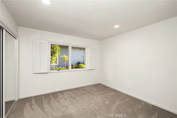 a bathroom with a sink toilet a mirror and shower