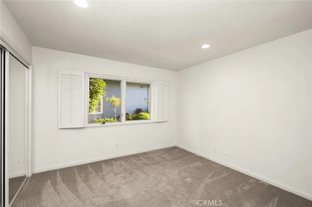 a bathroom with a sink toilet a mirror and shower