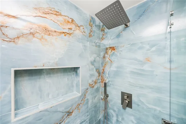 a bathroom with double sink and a mirror