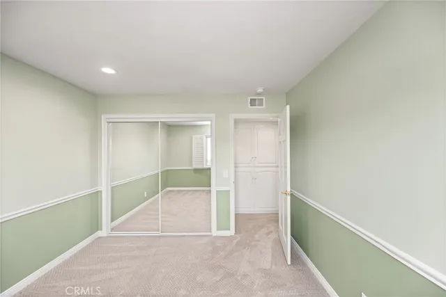 a view of storage and utility room with washer and dryer