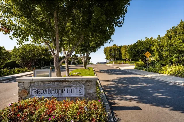 an aerial view of a house with a yard and lake view