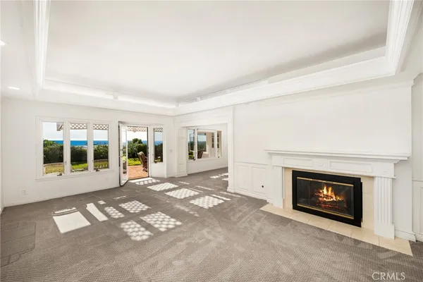 a view of empty room with a fireplace