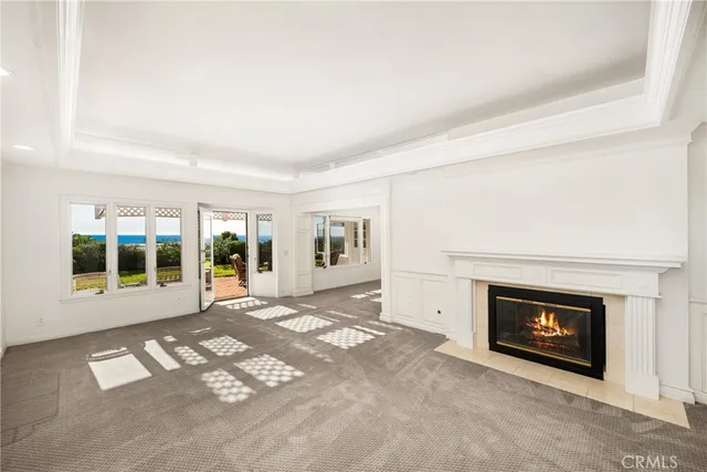 a view of empty room with a fireplace
