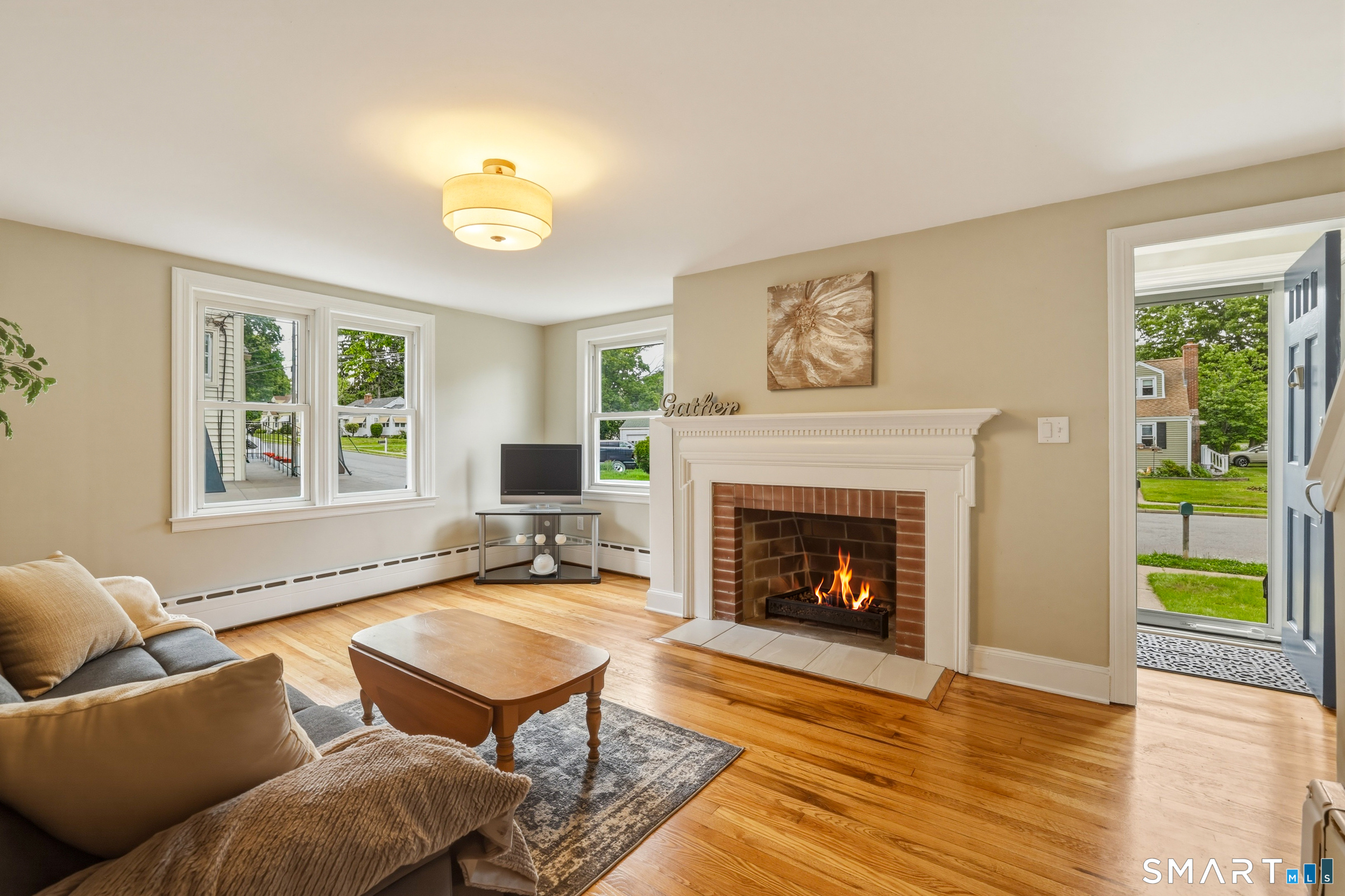 96 Campfield Road Manchester, CT 06040 - Photo 3 of 38 Living room with wood burning fireplace