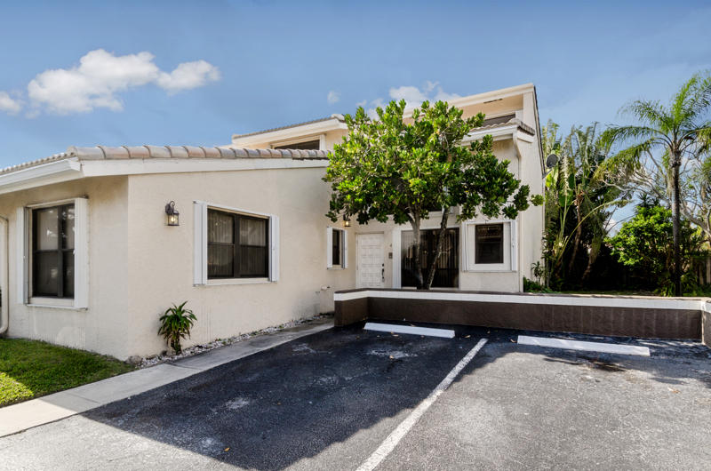 363 West Camino Real, Unit 4 Boca Raton, FL 33432 - Photo 36 of 37 a house with a yard in front of it