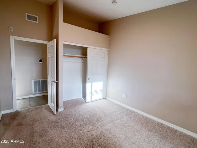 a bathroom with a granite countertop sink toilet mirror and bathtub