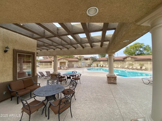 a view of dinning table and chairs in the patio