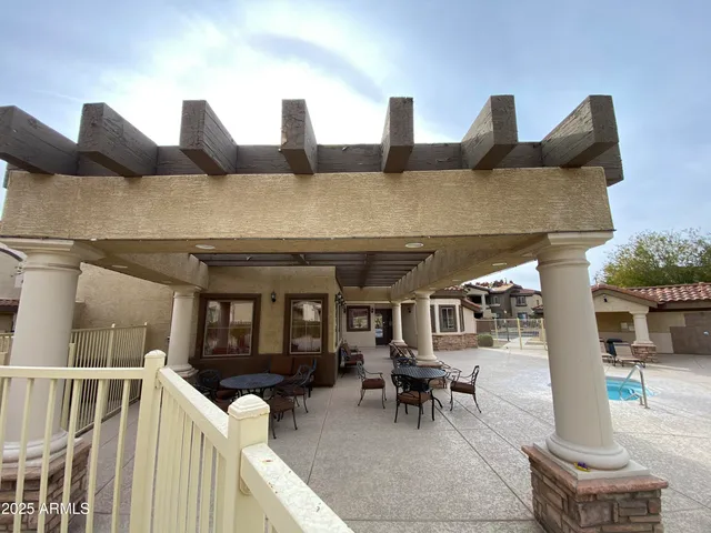 a view of a house with pool porch and furniture