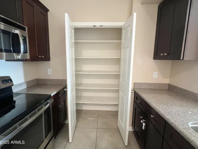 a kitchen with a sink and a stove top oven