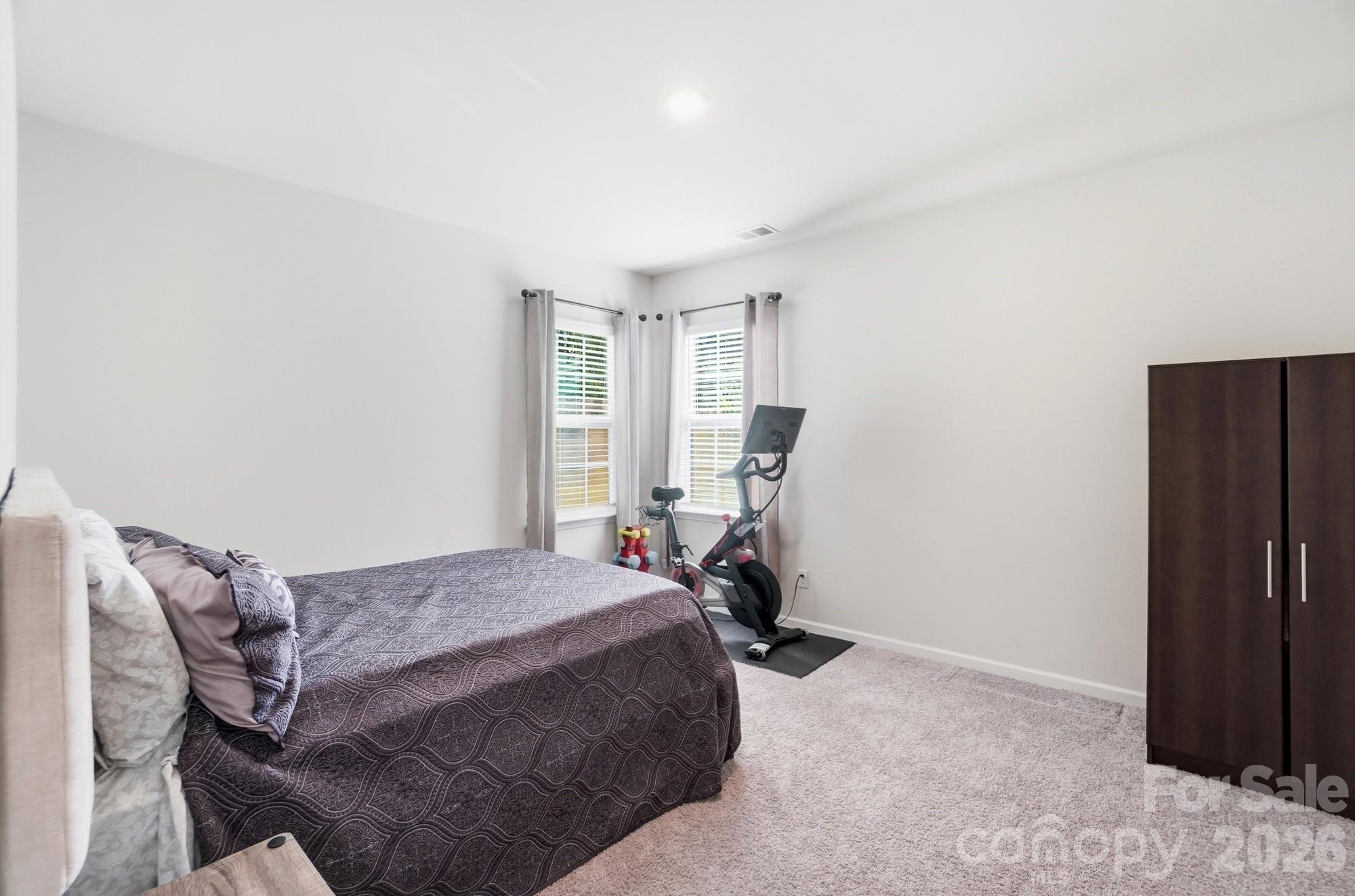 116 Timbergreen Court Troutman, NC 28166 - Photo 19 of 43 a bedroom with a bed and a window