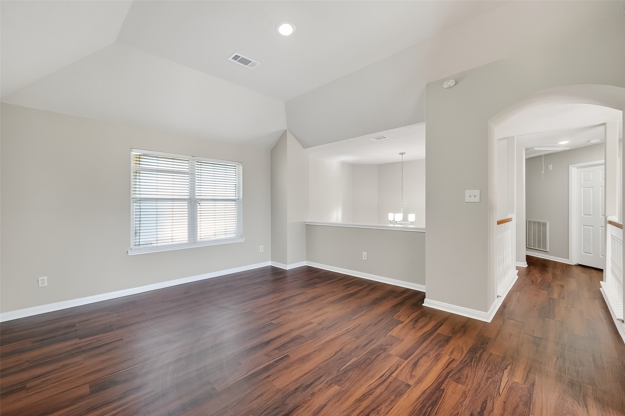 6506 Rose Willow Lane Spring, TX 77379 - Photo 16 of 38 an empty room with wooden floor and windows