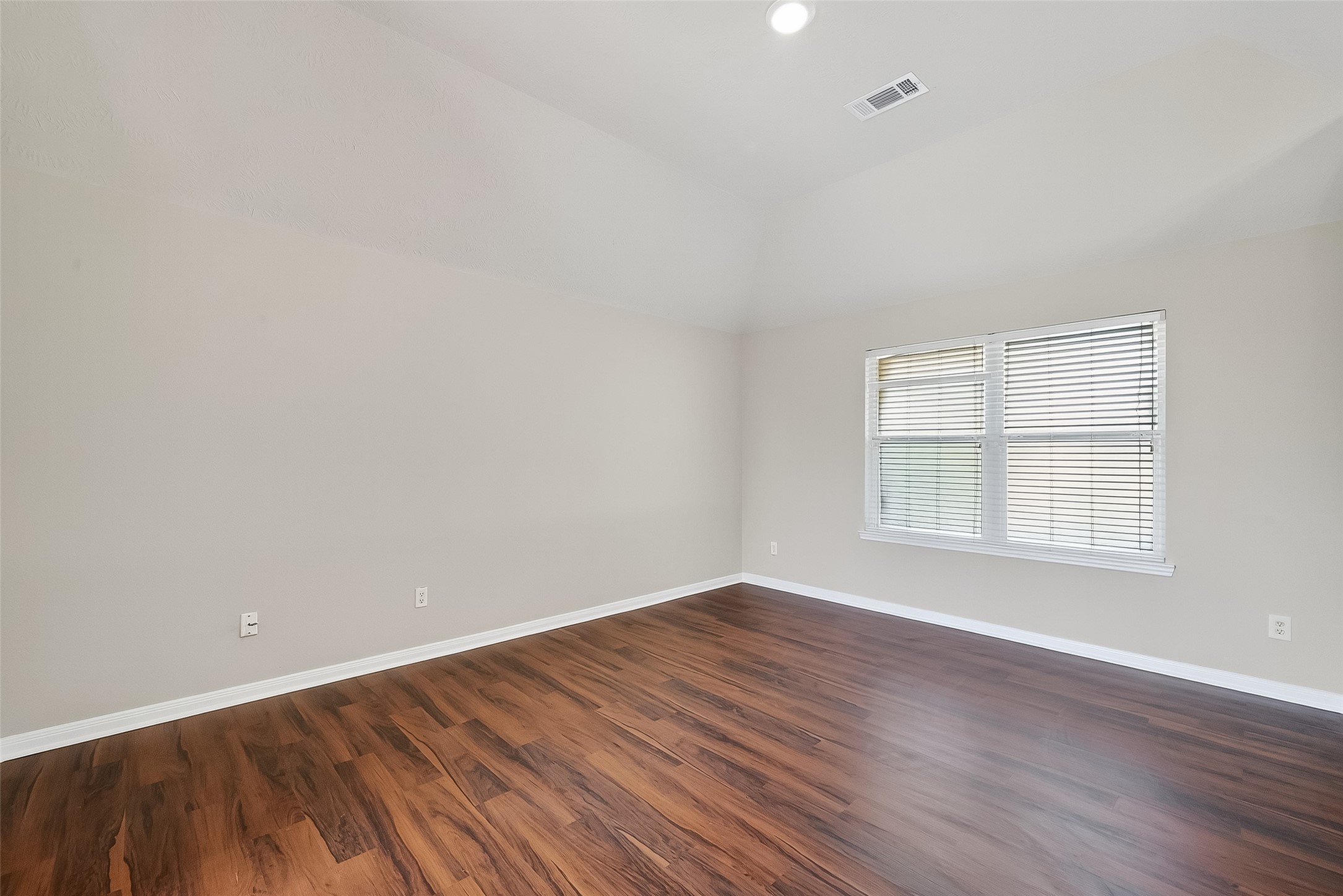 6506 Rose Willow Lane Spring, TX 77379 - Photo 17 of 38 an empty room with wooden floor and windows