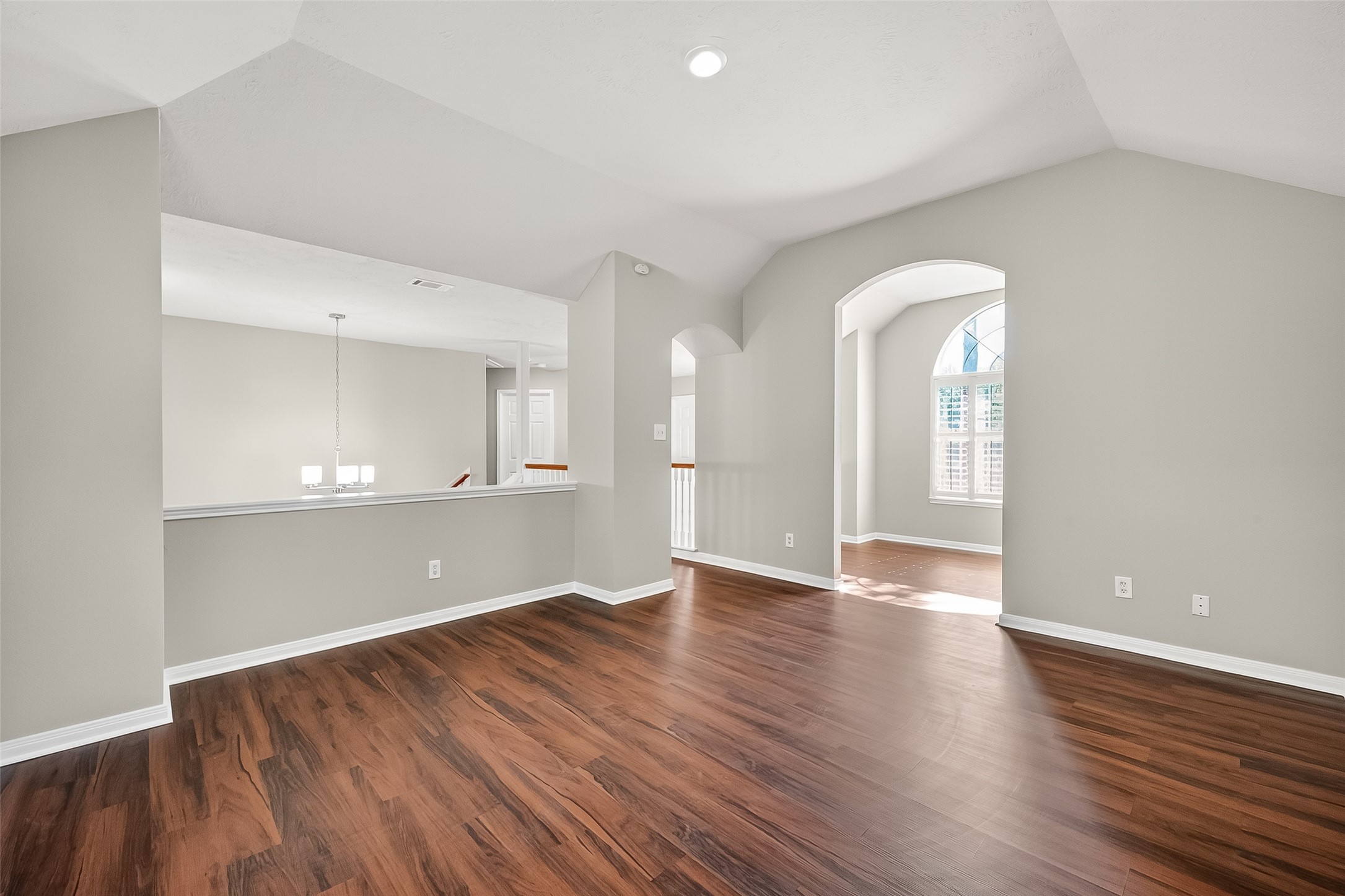 6506 Rose Willow Lane Spring, TX 77379 - Photo 18 of 38 a view of empty room with wooden floor and windows