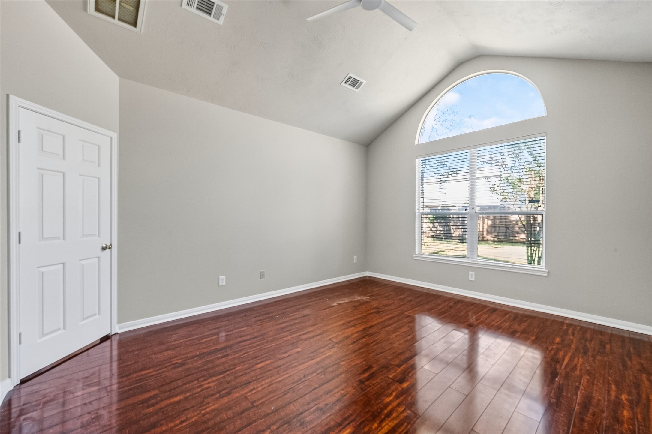 6506 Rose Willow Lane Spring, TX 77379 - Photo 28 of 38 an empty room with wooden floor and windows