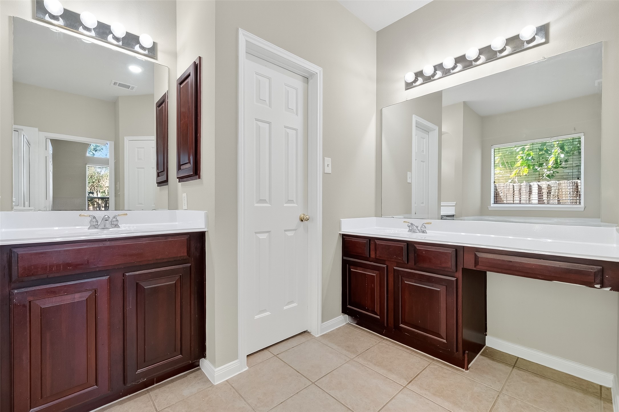 6506 Rose Willow Lane Spring, TX 77379 - Photo 30 of 38 a bathroom with a granite countertop double vanity sink and a mirror