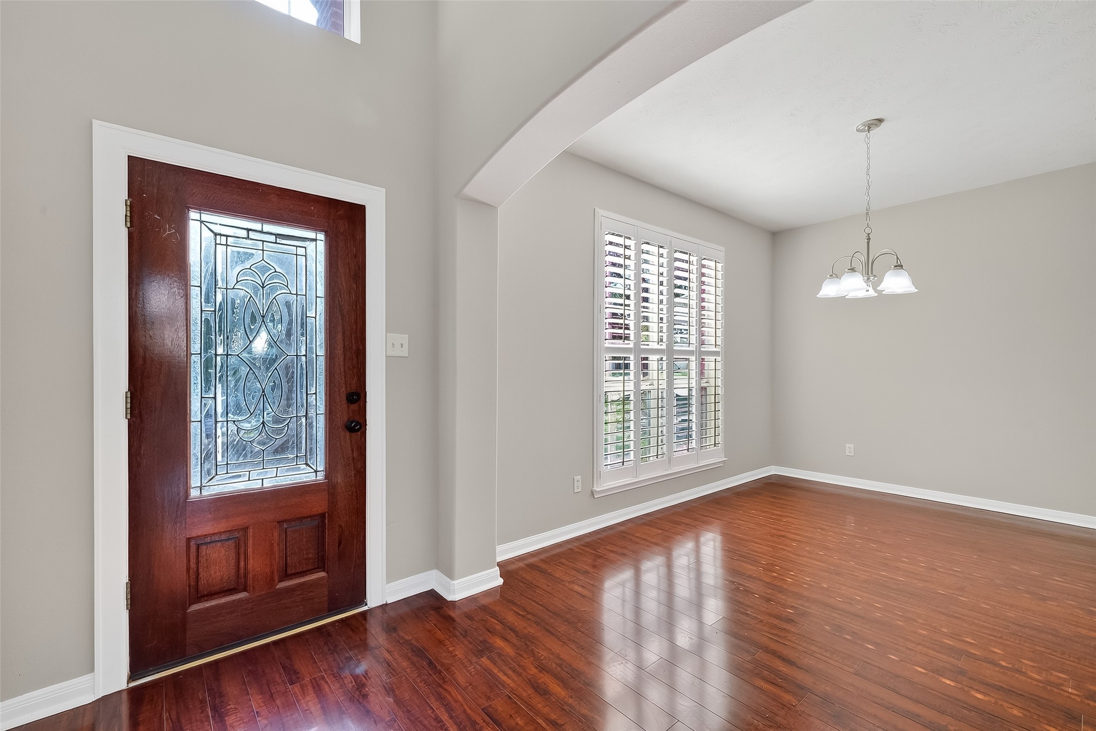 6506 Rose Willow Lane Spring, TX 77379 - Photo 3 of 38 a view of an empty room with wooden floor and a window