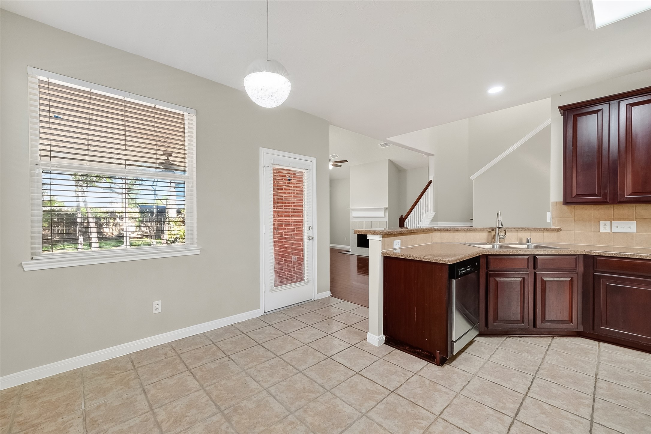6506 Rose Willow Lane Spring, TX 77379 - Photo 9 of 38 a kitchen with stainless steel appliances granite countertop a stove and a sink