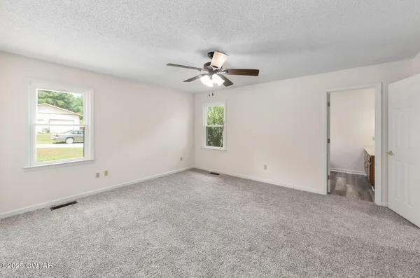 a view of an empty room with a window