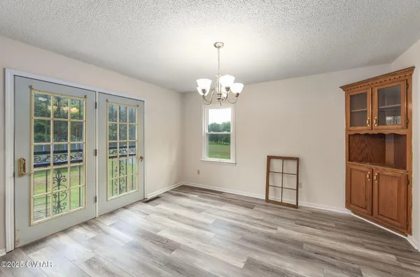 a bathroom with a tub and a window