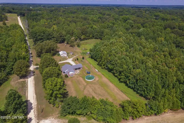 an aerial view of residential houses with outdoor space