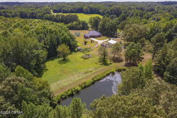 an aerial view of residential house with outdoor space