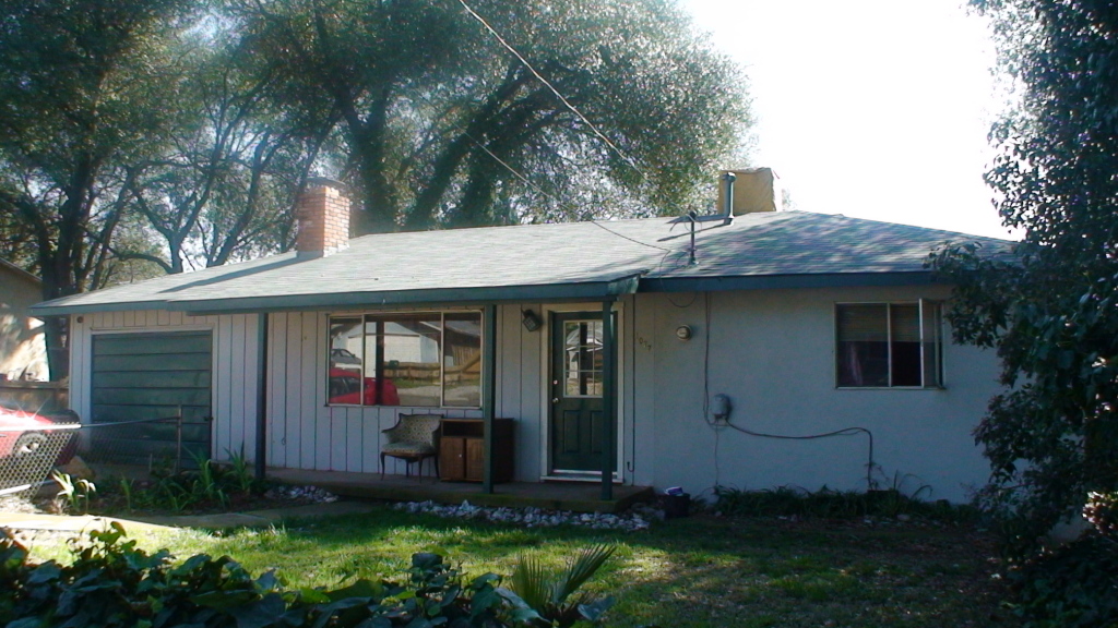 1077 Harpole Road Redding, CA 96002 - Photo 1 of 8 a view of a house with backyard and garden
