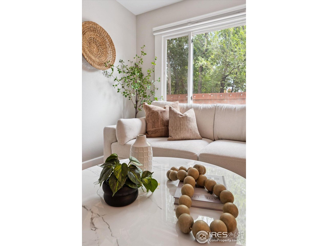 2201 Pearl Street, Unit 2 Boulder, CO 80302 - Photo 15 of 37 a living room with furniture and flower plants