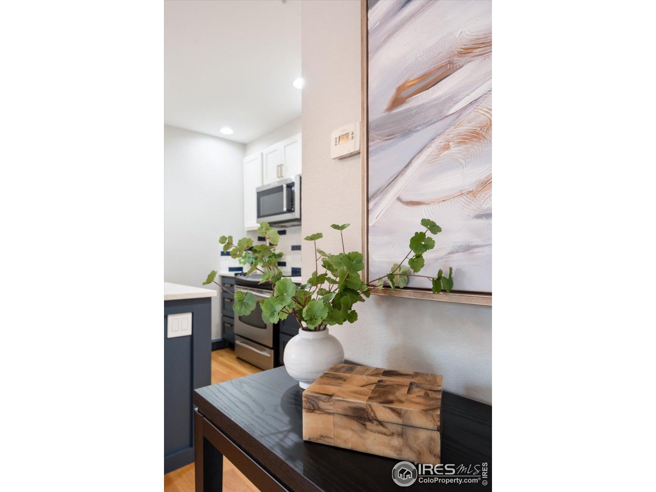 2201 Pearl Street, Unit 2 Boulder, CO 80302 - Photo 17 of 37 a living room with furniture and a potted plant