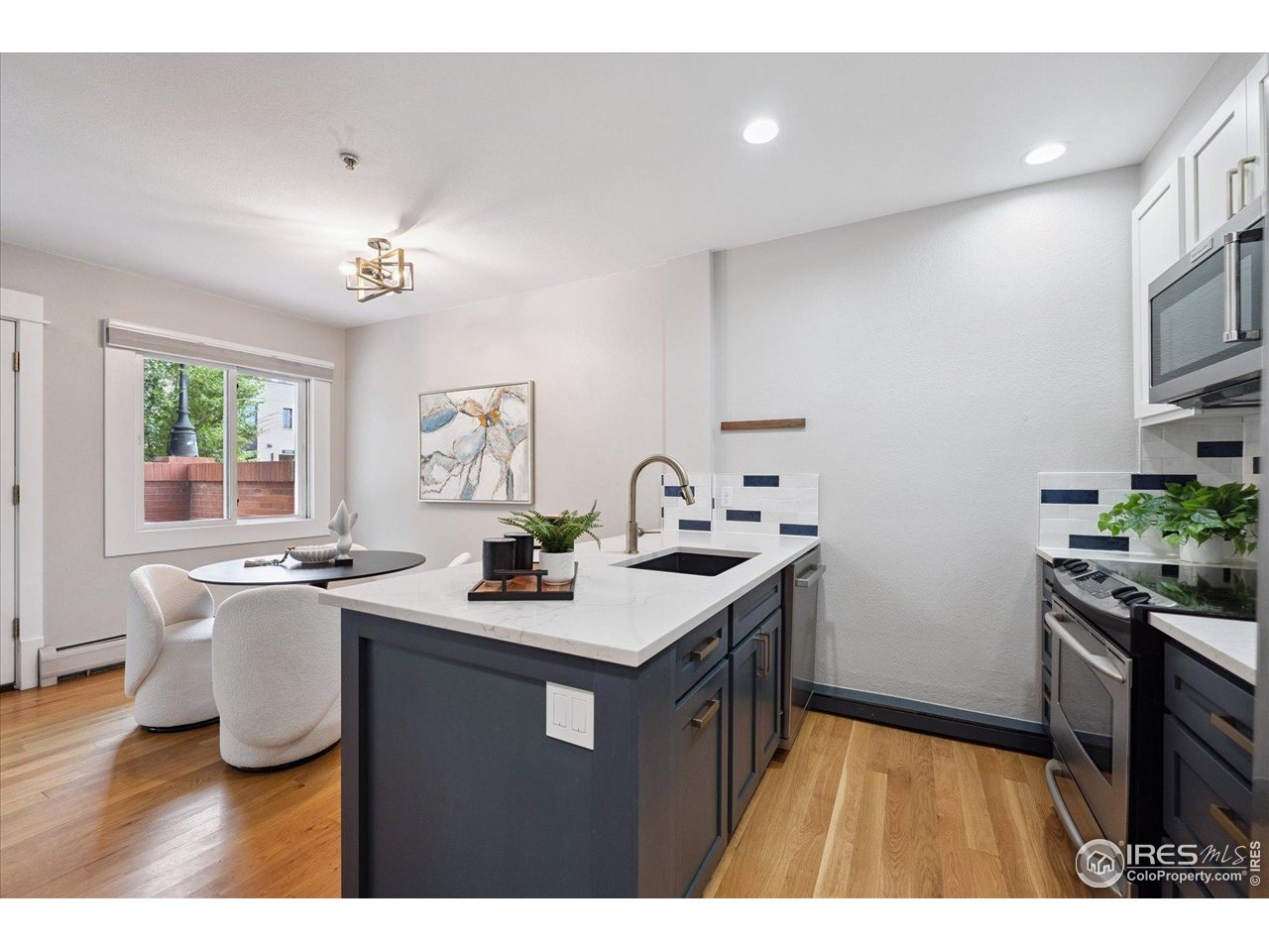2201 Pearl Street, Unit 2 Boulder, CO 80302 - Photo 3 of 37 a kitchen with a sink appliances and cabinets