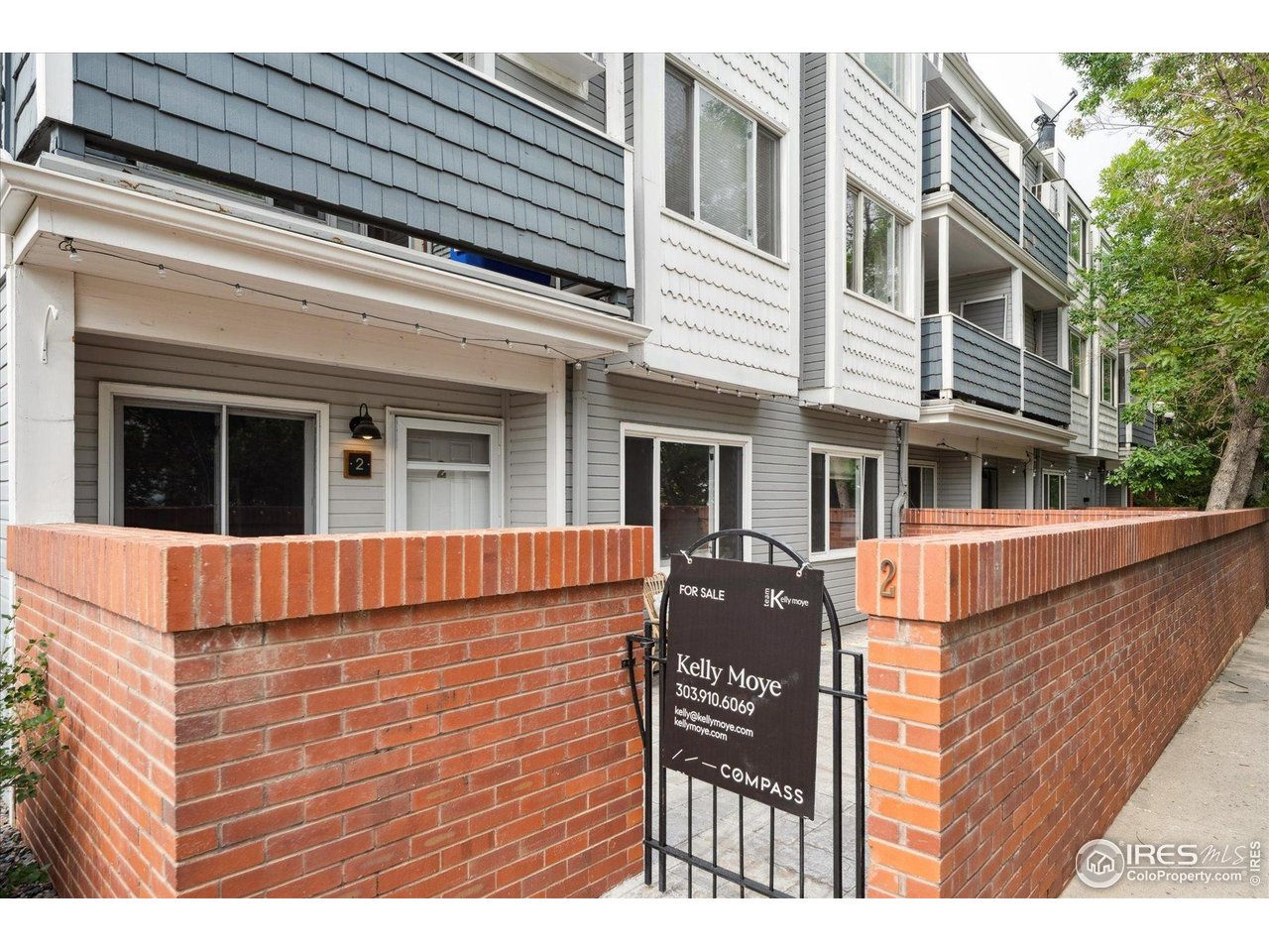 2201 Pearl Street, Unit 2 Boulder, CO 80302 - Photo 4 of 37 a view of brick house with large windows