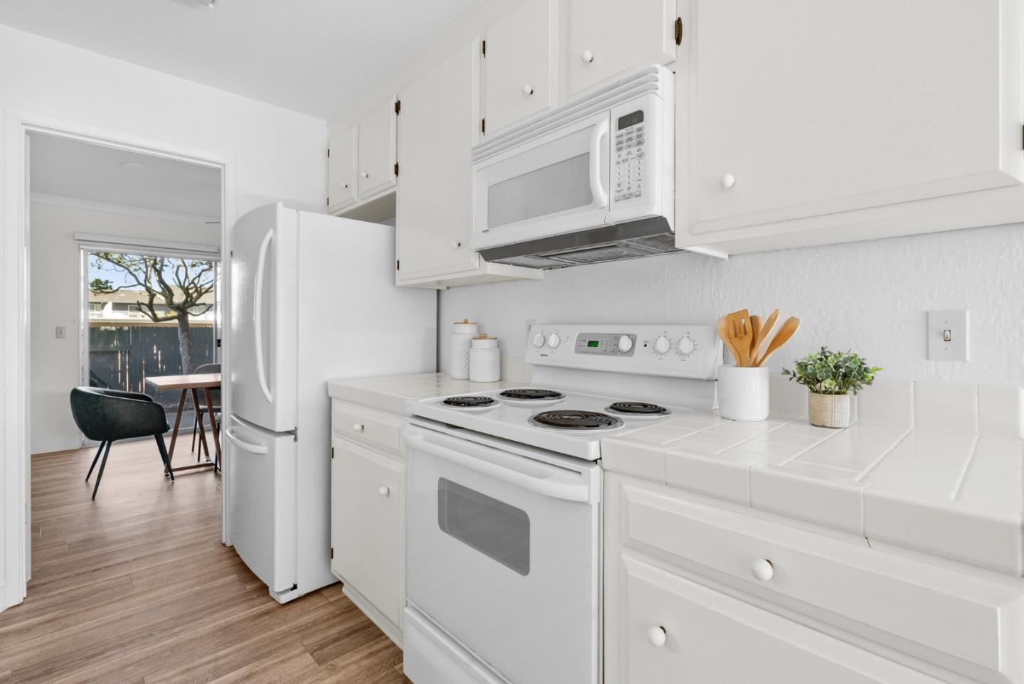 120 Paseo Ballena Aptos, CA 95003 - Photo 14 of 69 a kitchen with stainless steel appliances a white stove cabinets and wooden floor
