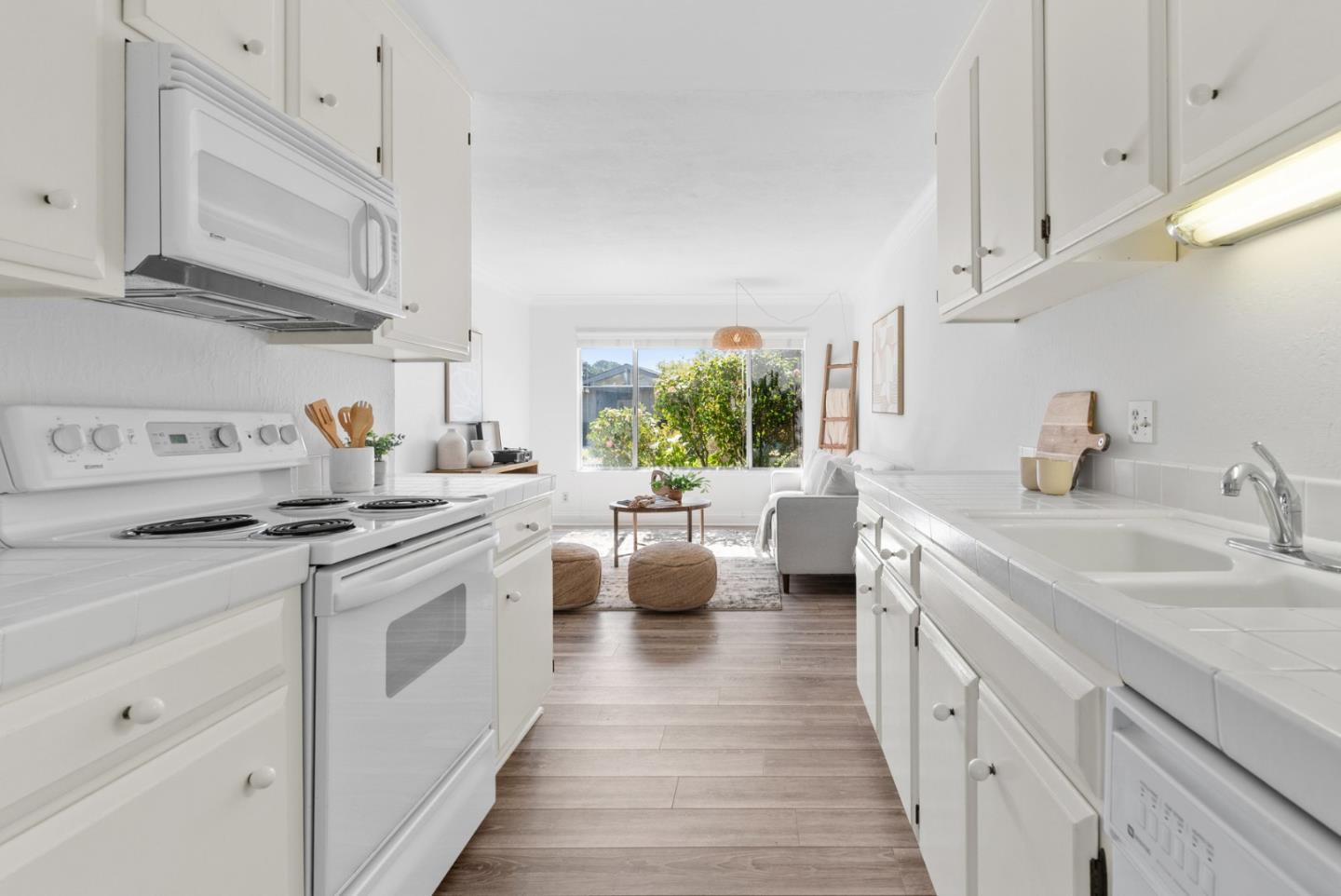 120 Paseo Ballena Aptos, CA 95003 - Photo 17 of 69 a kitchen with stainless steel appliances a white stove top oven and white cabinets