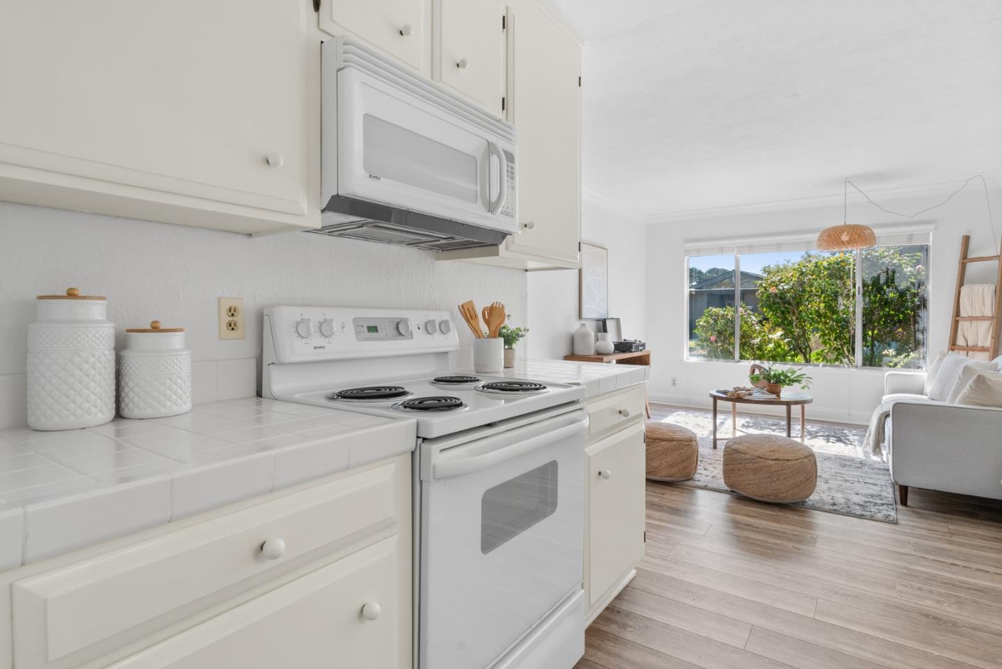 120 Paseo Ballena Aptos, CA 95003 - Photo 18 of 69 a kitchen with stainless steel appliances granite countertop a stove a sink and a microwave