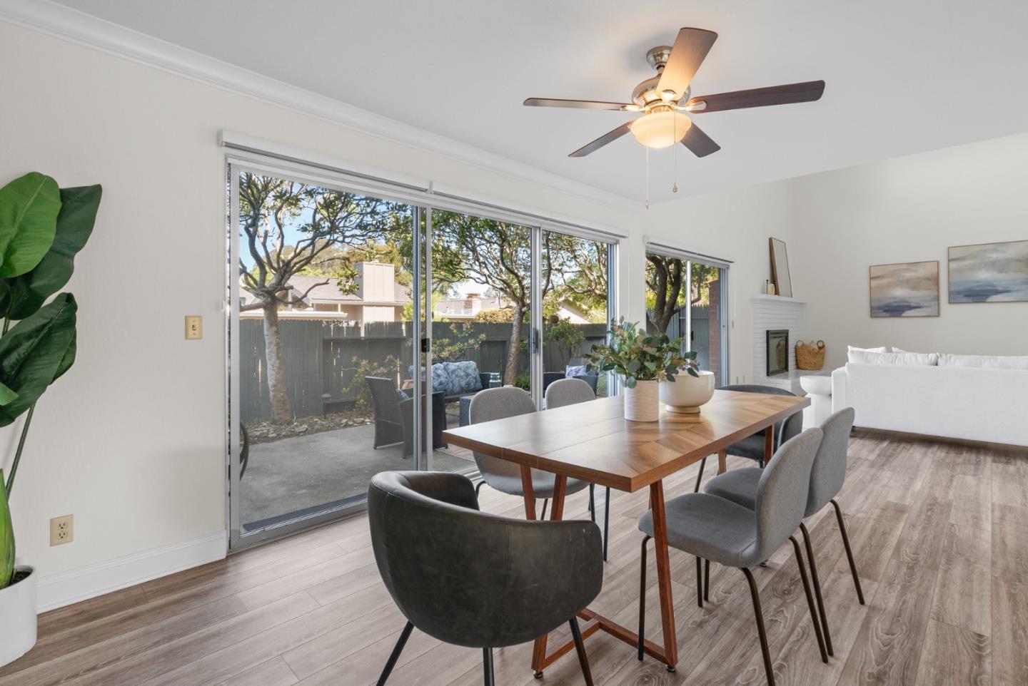 120 Paseo Ballena Aptos, CA 95003 - Photo 19 of 69 a dining room with furniture a chandelier and wooden floor