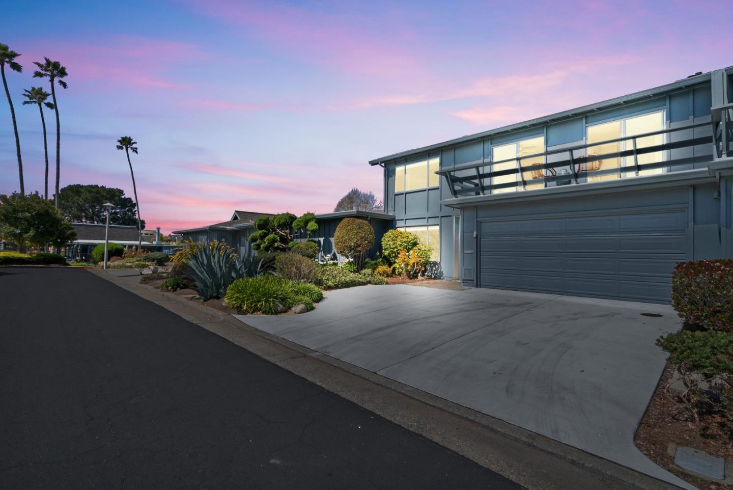 120 Paseo Ballena Aptos, CA 95003 - Photo 3 of 69 a front view of a house with a yard and garage