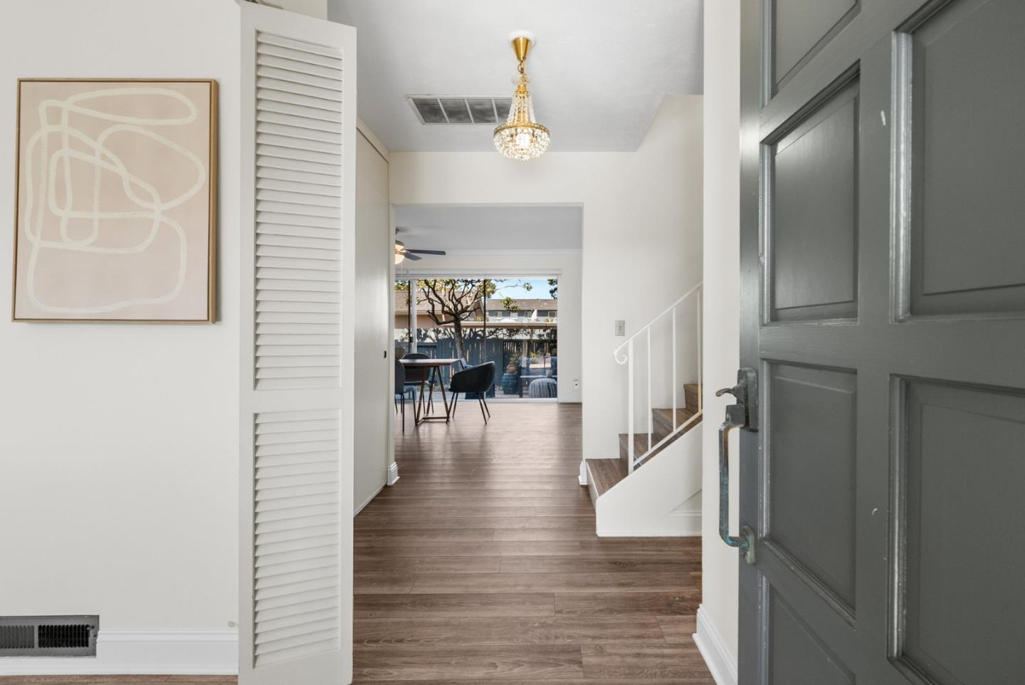 120 Paseo Ballena Aptos, CA 95003 - Photo 33 of 69 a hallway with wooden floor table and chairs
