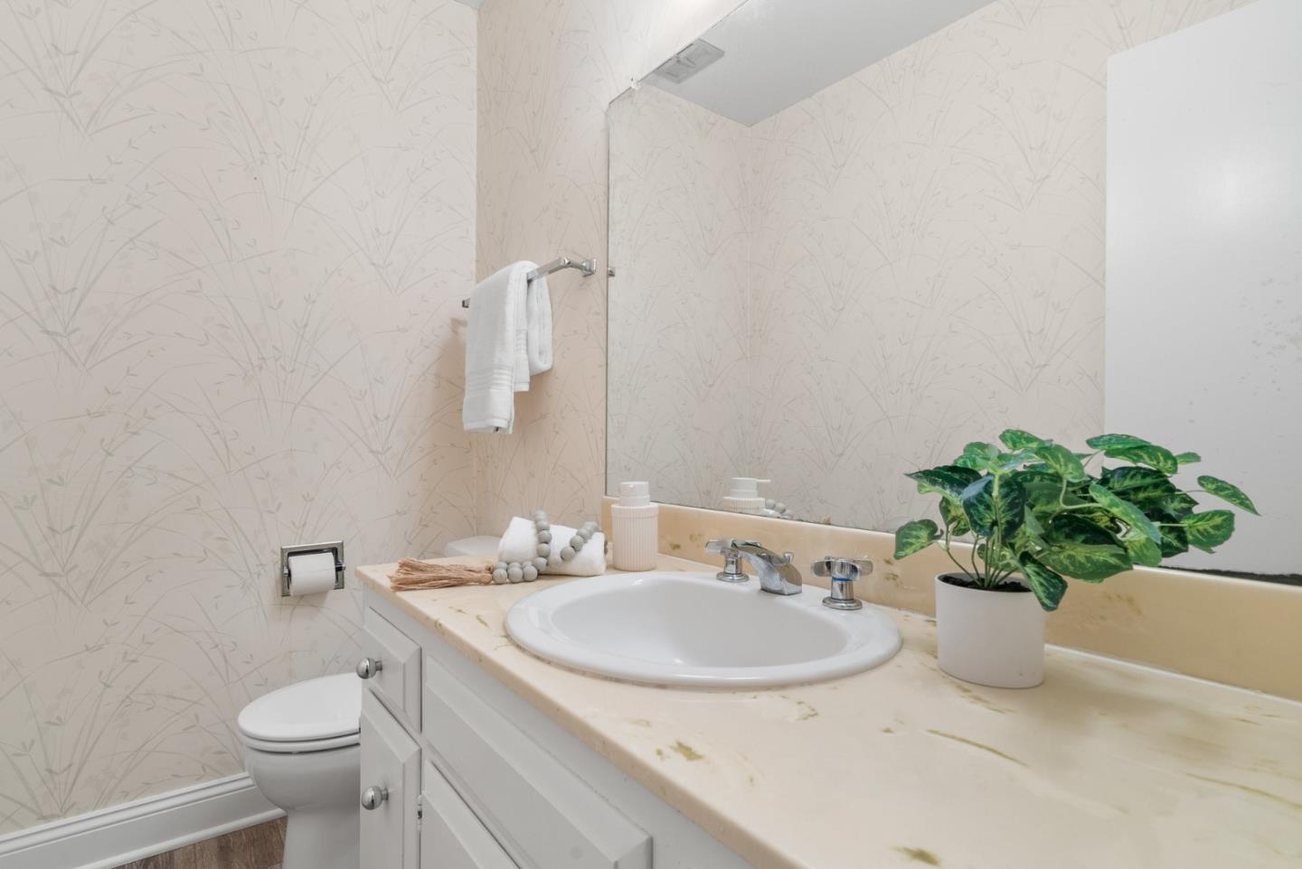 120 Paseo Ballena Aptos, CA 95003 - Photo 34 of 69 a bathroom with a sink a toilet and a mirror